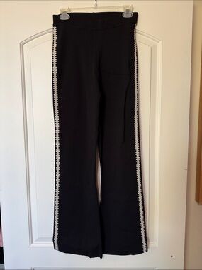 Nanushka Black Boot‑Cut Stretch Knit Pants with White Side Embroidery